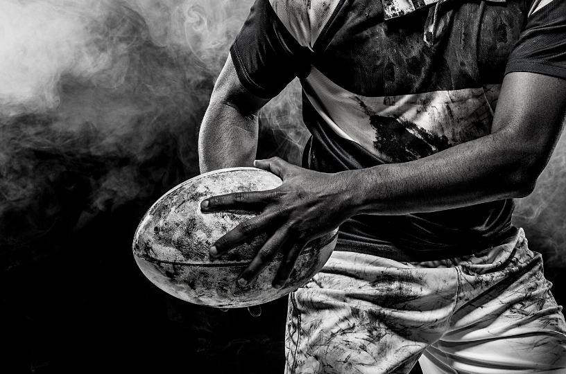 Dynamic rugby player graphic symbolizing the intense energy of 6 Nations at The Barley Mow, Hersham.